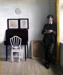 Interior with Young Man Reading - Vilhelm Hammershoi